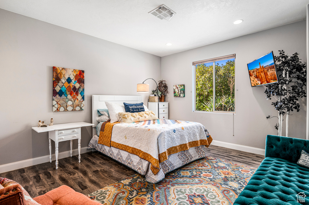 Bedroom featuring dark wood-type flooring and recessed lighting