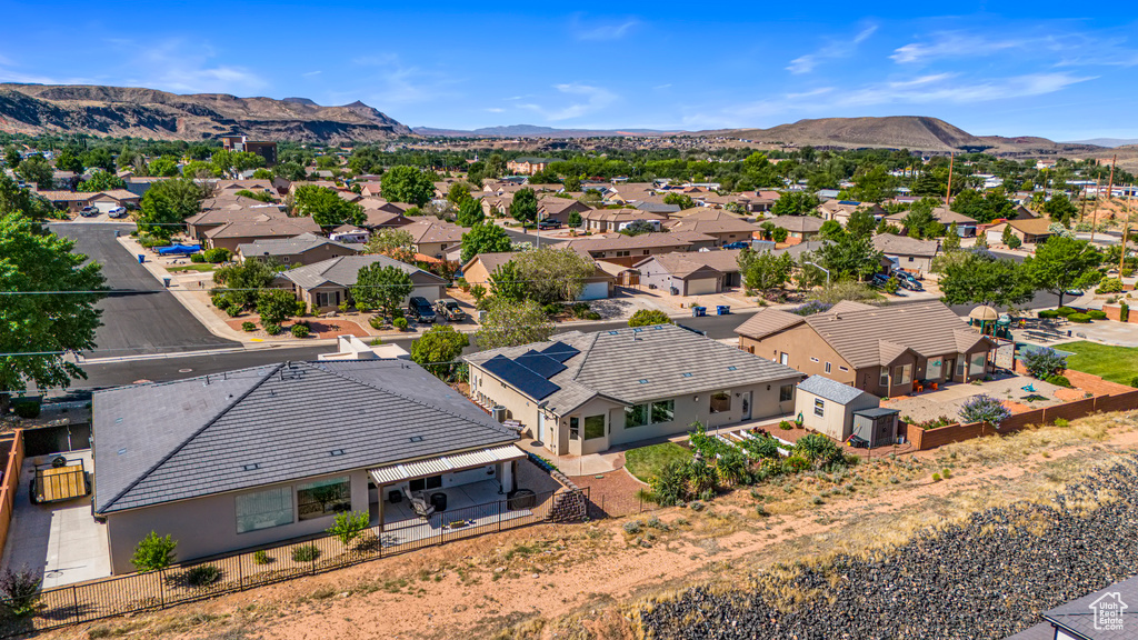 Aerial view of residential area featuring a mountainous background