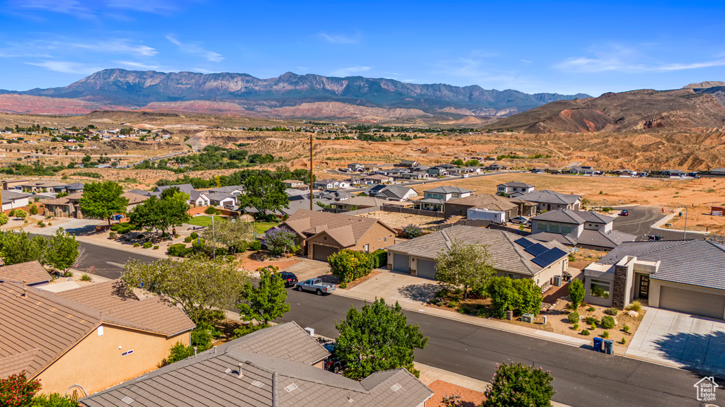 Aerial view of residential area featuring mountains