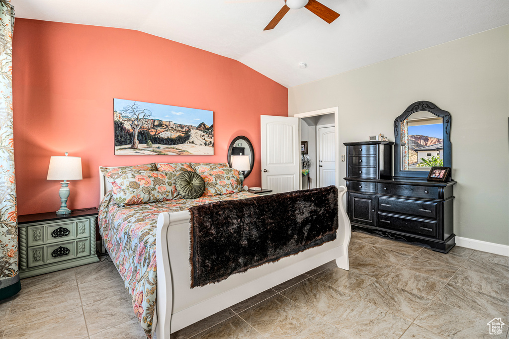 Bedroom with vaulted ceiling and ceiling fan