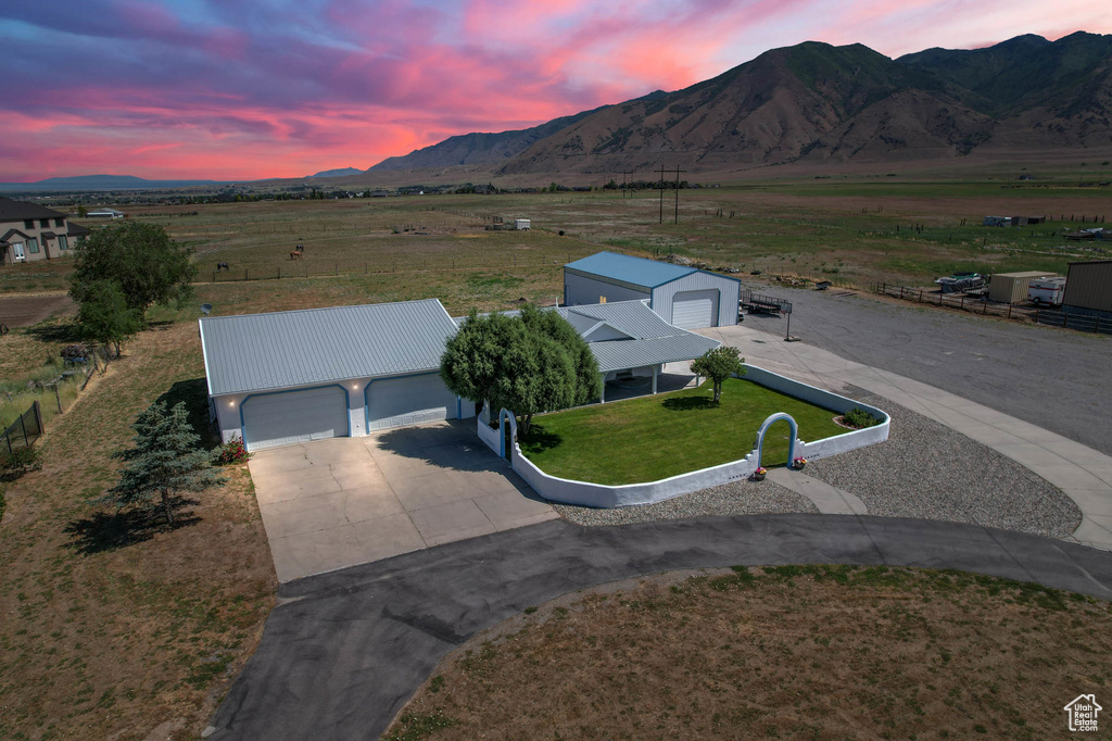 Aerial view at dusk of a mountain view and a rural view