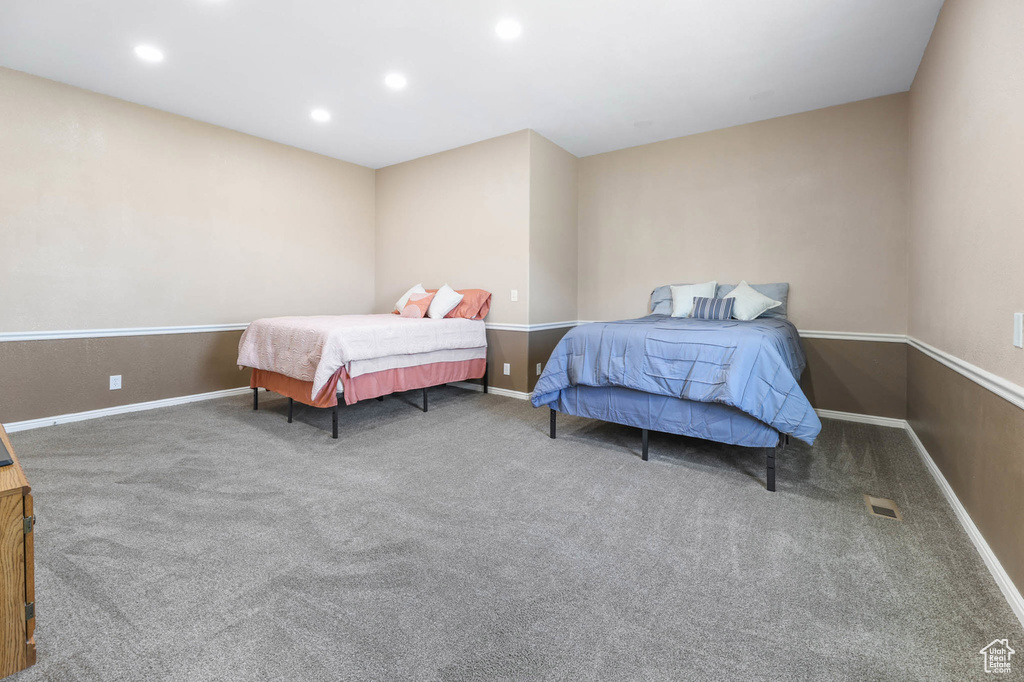 Bedroom with carpet floors and recessed lighting