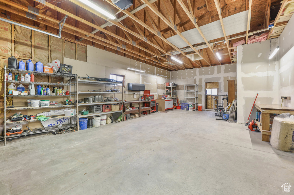Below grade area with a garage and a workshop area