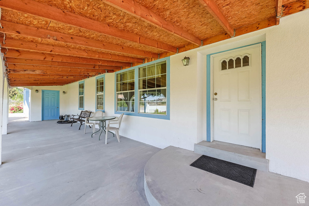 Property entrance with stucco siding