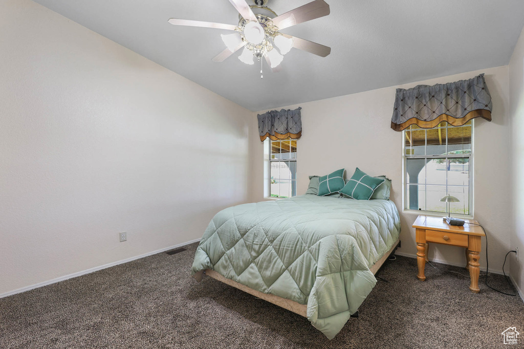 Bedroom featuring carpet flooring and ceiling fan
