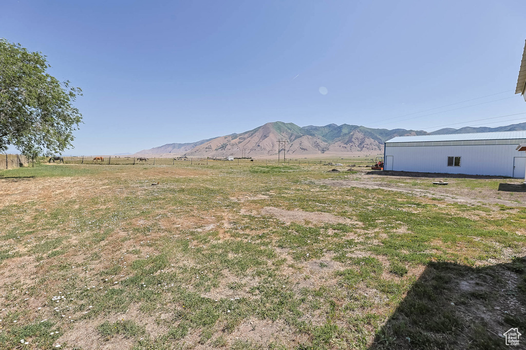 View of yard with a mountain view and a view of countryside