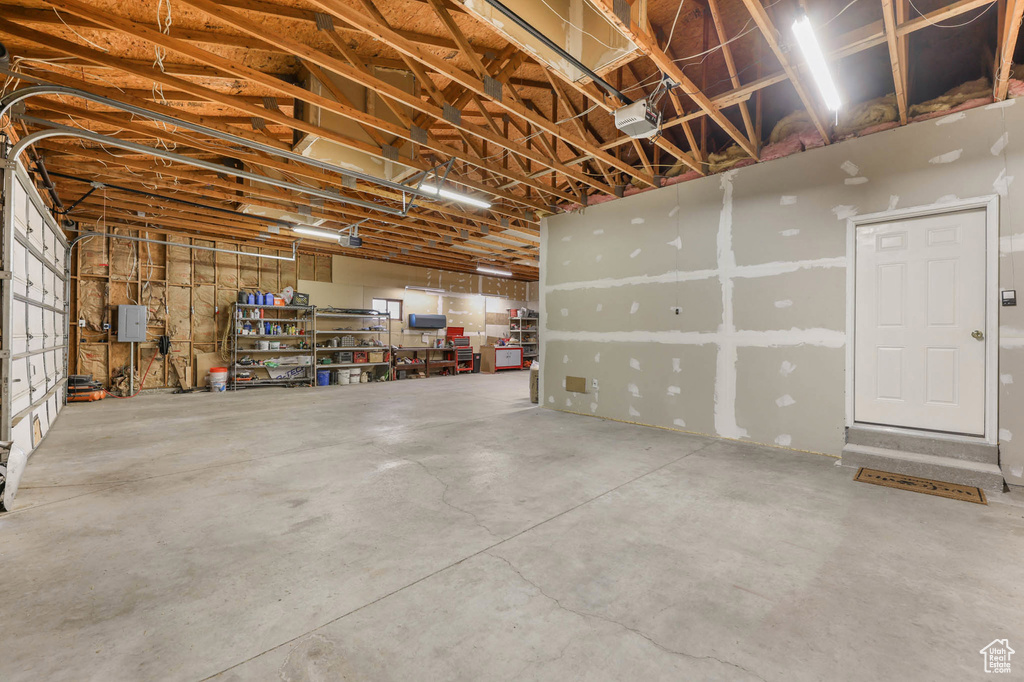 Garage featuring a garage door opener