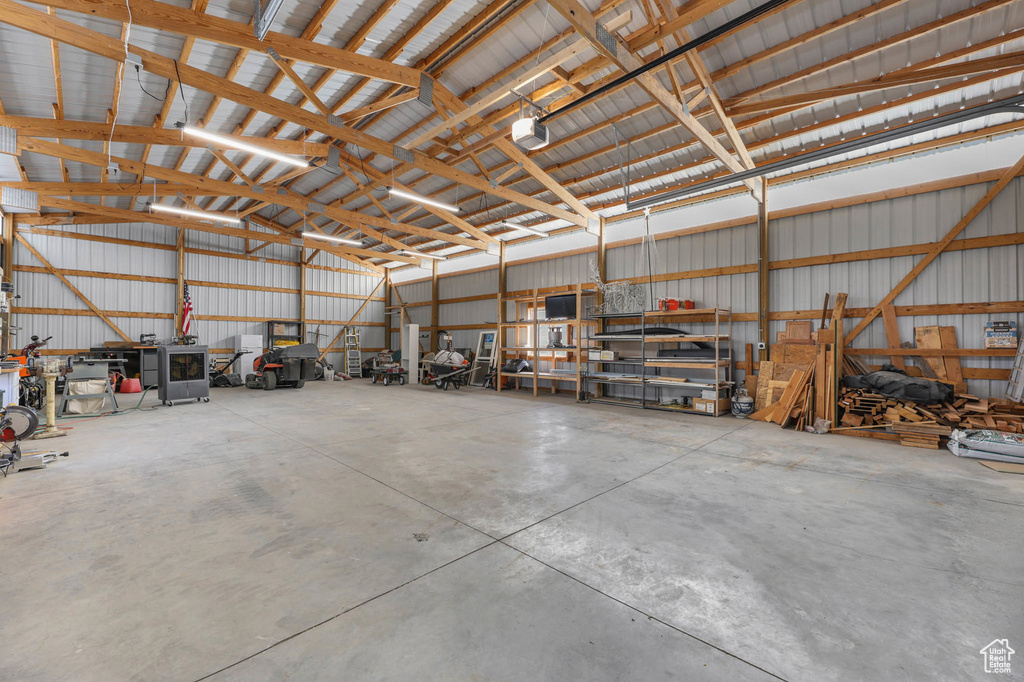 Garage with a garage door opener and metal wall