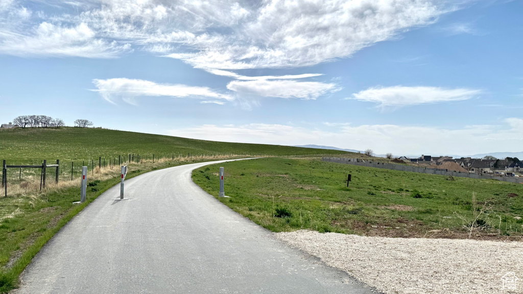 View of asphalt street with a view of countryside