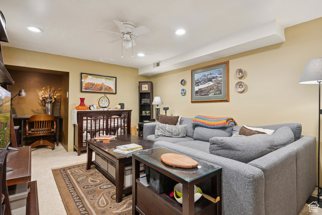 Living room featuring a ceiling fan and recessed lighting