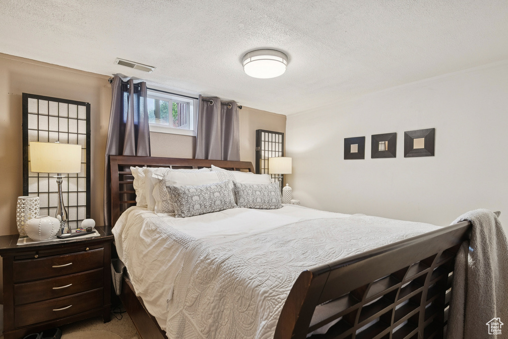 Bedroom featuring a textured ceiling