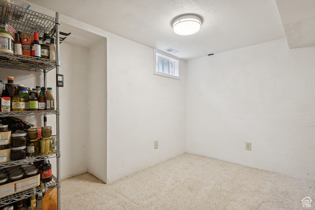 Basement with carpet flooring