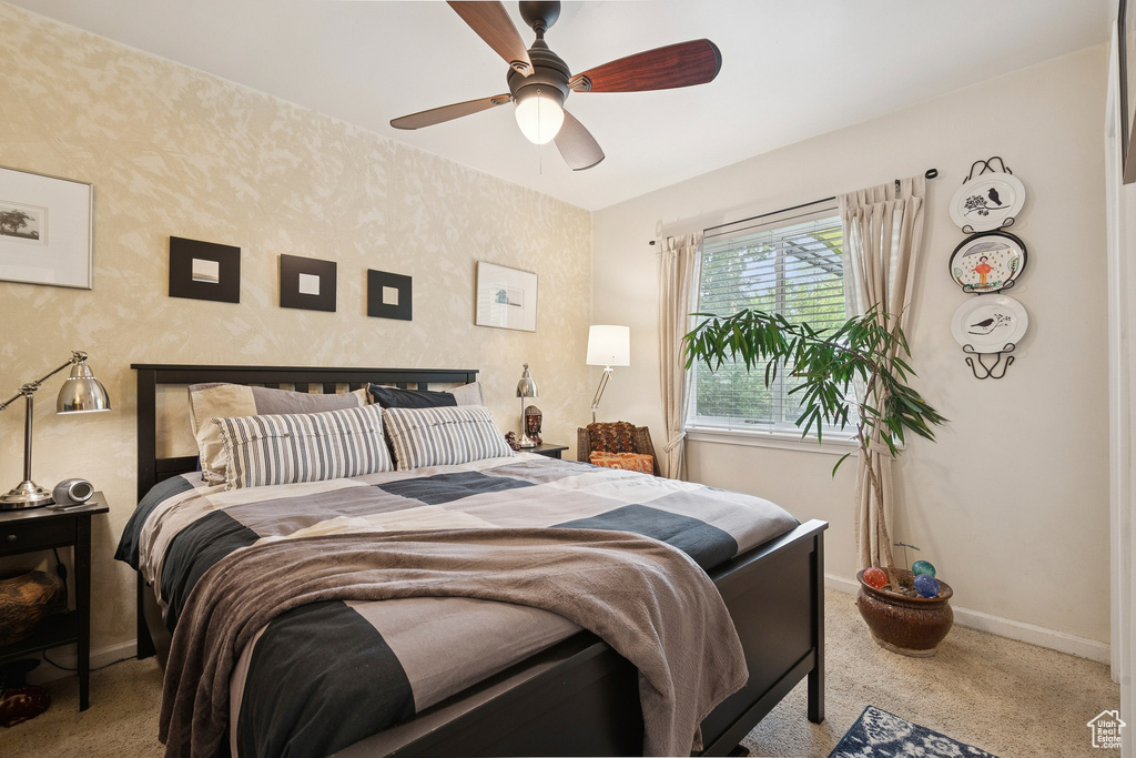 Bedroom featuring carpet floors and ceiling fan