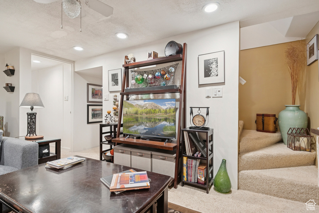 Home office featuring carpet flooring, ceiling fan, recessed lighting, and a textured ceiling