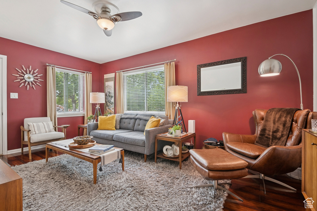 Living room with wood finished floors and a ceiling fan