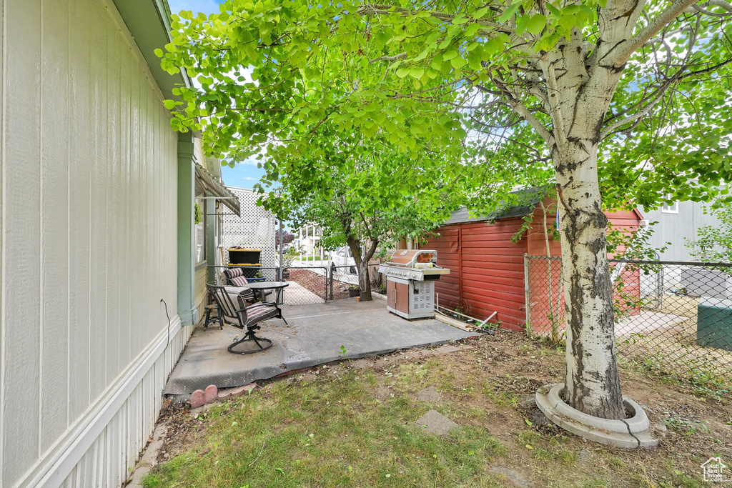 Fenced backyard featuring a patio area