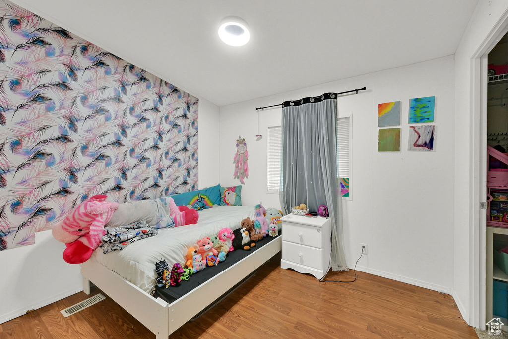 Bedroom featuring wood finished floors