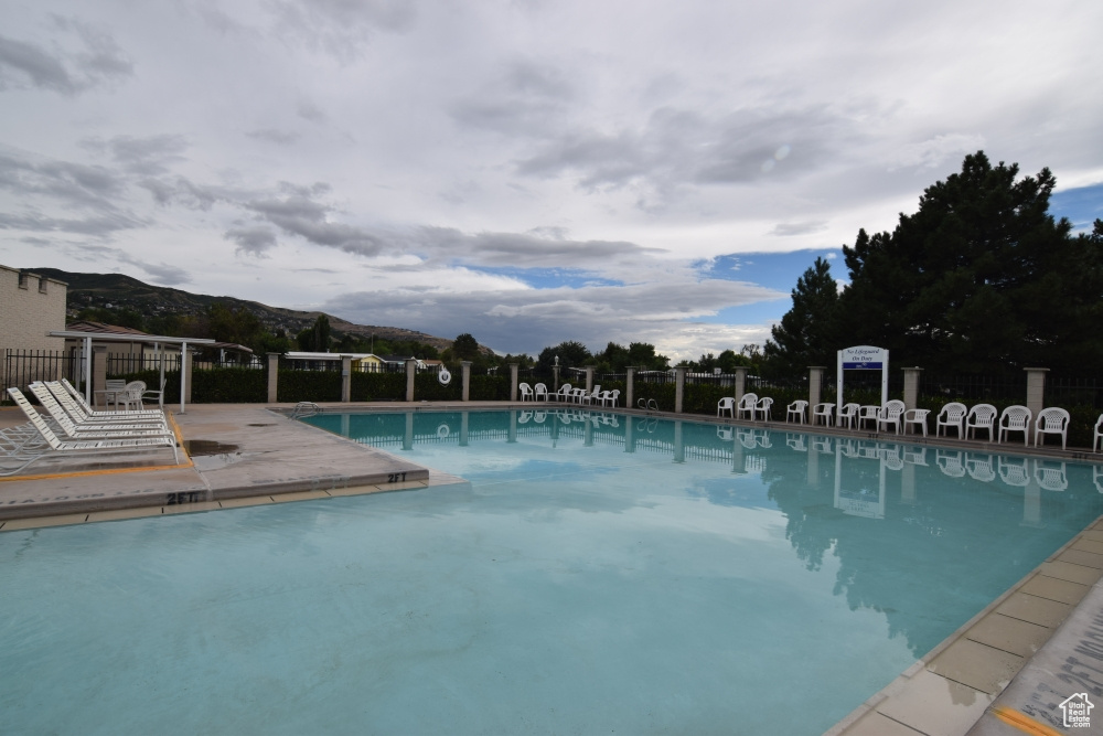 Community pool with a mountain view