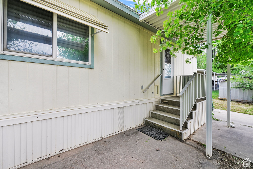 Doorway to property with a patio