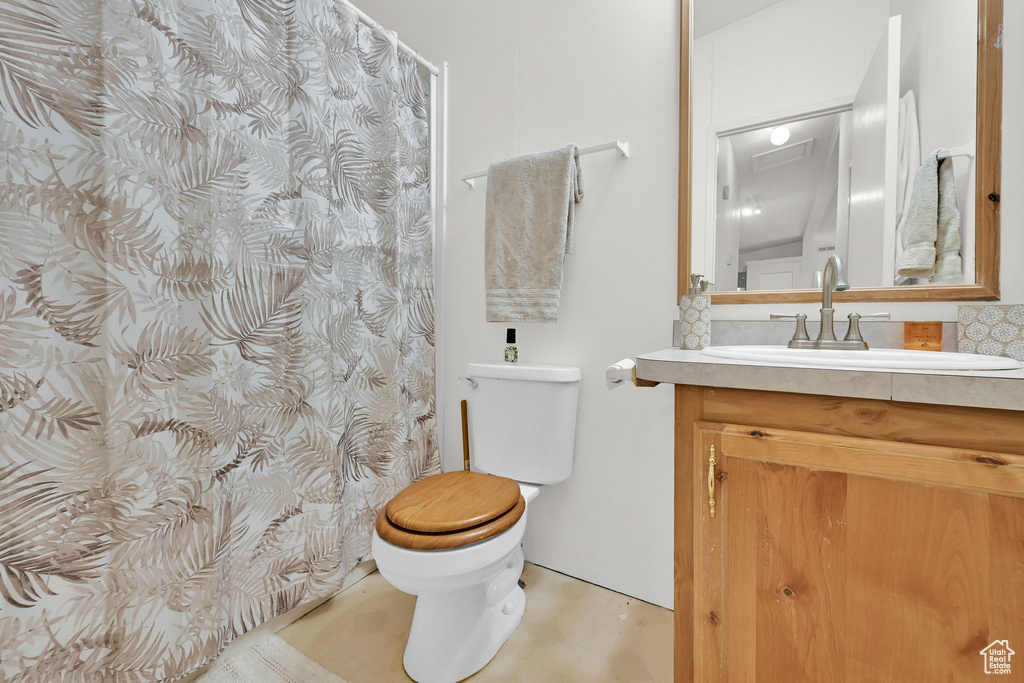 Full bath featuring vanity and a shower with shower curtain