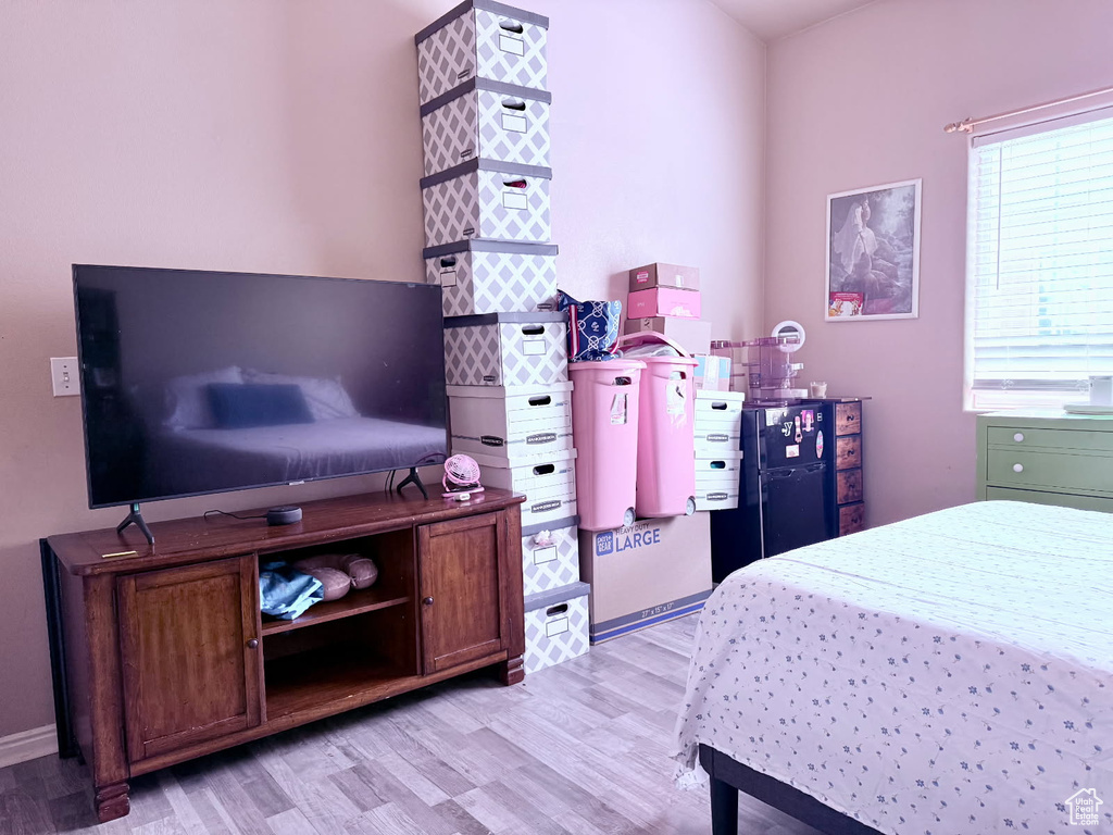 Bedroom with light wood-style floors