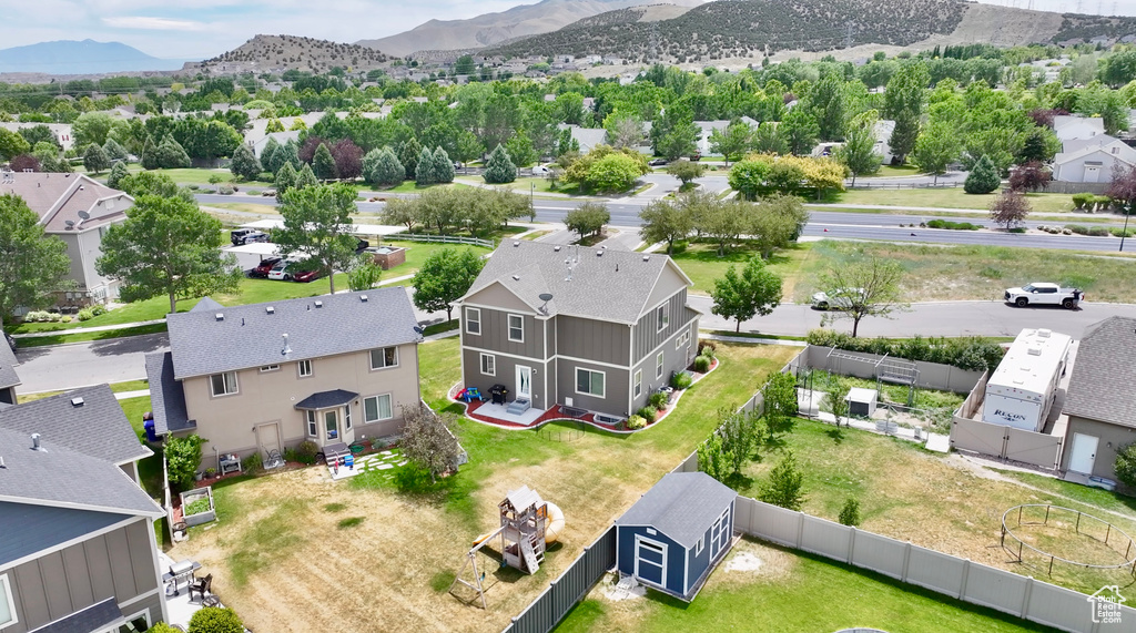 Aerial view of residential area with a mountainous background