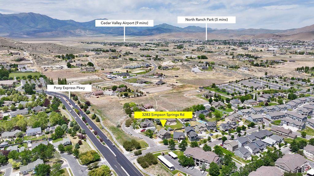 View of property location featuring a mountainous background and nearby suburban area