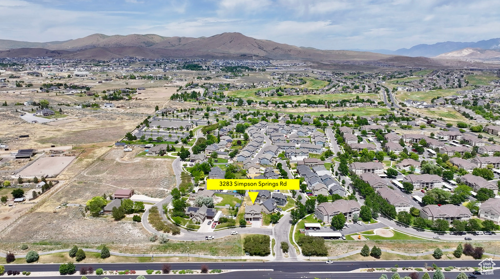View of property location with a mountainous background and nearby suburban area
