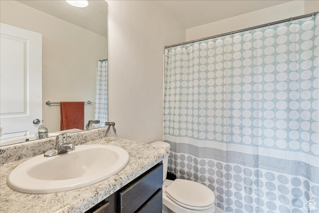 Bathroom featuring toilet and vanity