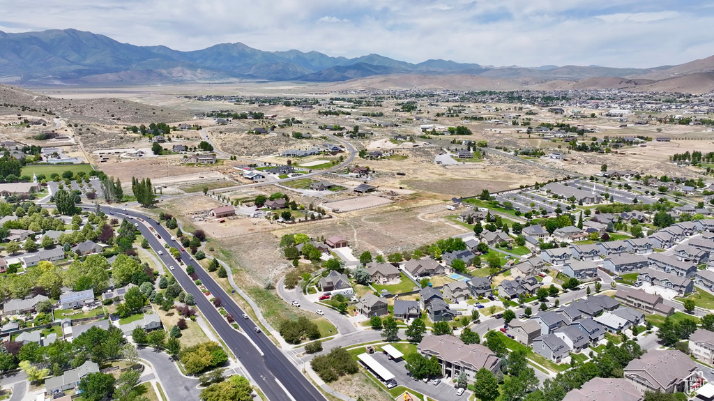 Aerial view of property\'s location with mountains and nearby suburban area