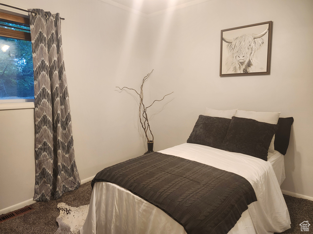 Bedroom featuring carpet flooring
