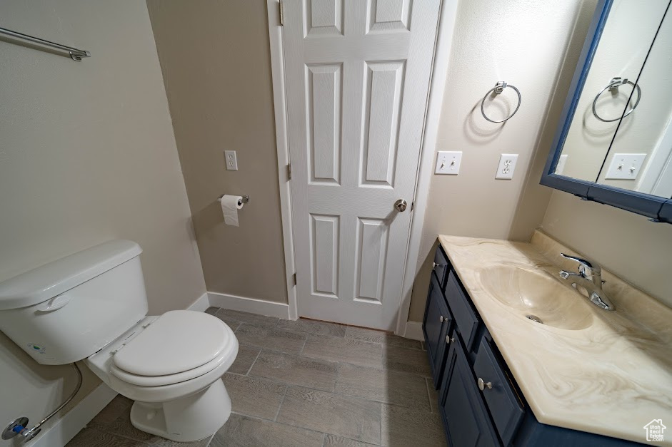Bathroom featuring vanity and toilet