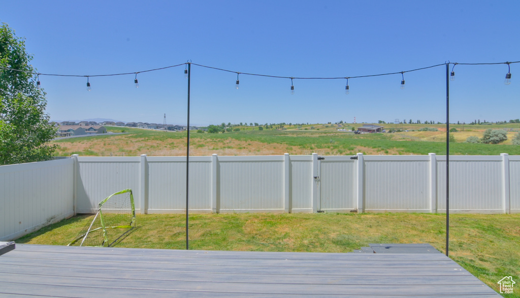 Deck with a fenced backyard
