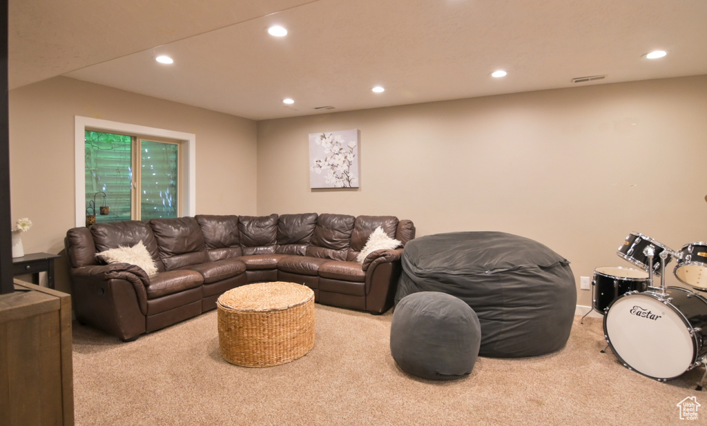 Living room with carpet flooring and recessed lighting