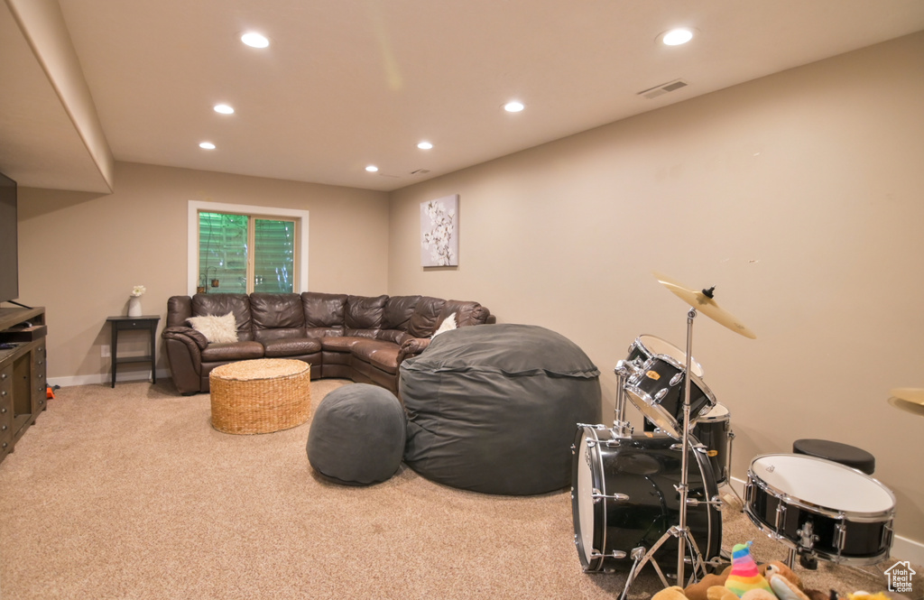 Living room with recessed lighting and carpet