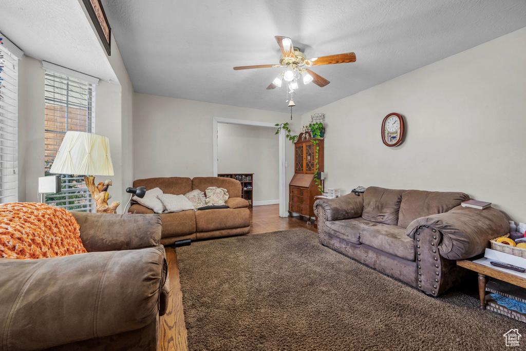 Living area featuring a ceiling fan