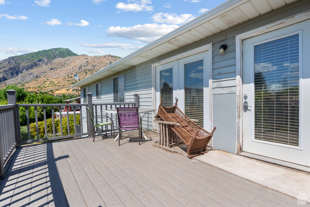 Wooden deck featuring a mountain view