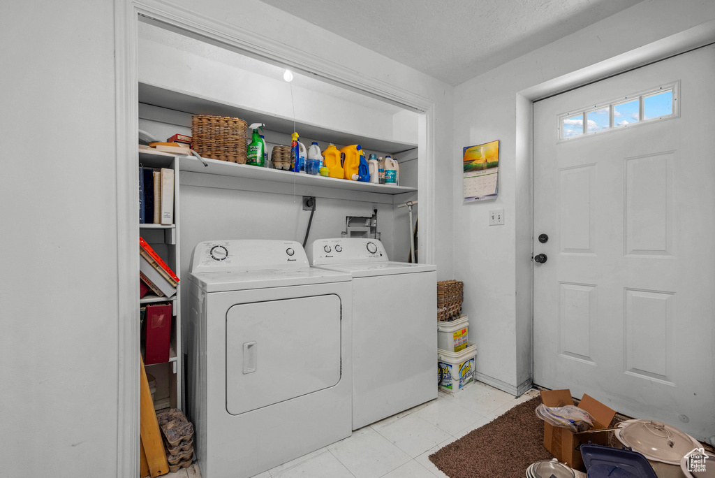 Laundry room featuring washing machine and clothes dryer