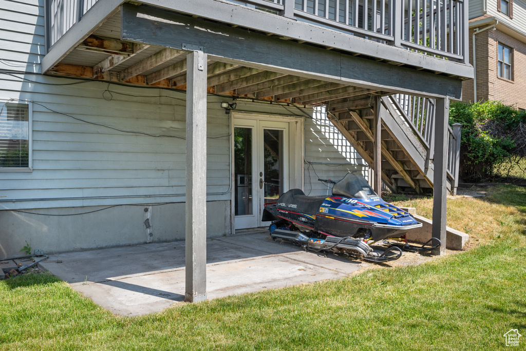 View of patio with stairs and french doors