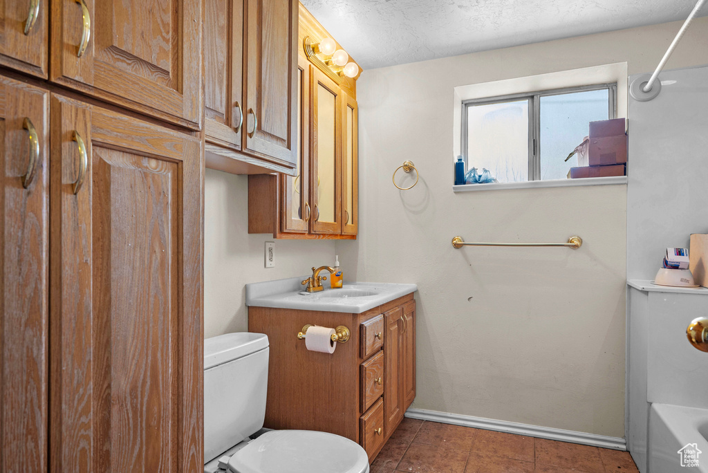 Full bathroom with vanity, a bath, a shower, and tile patterned flooring