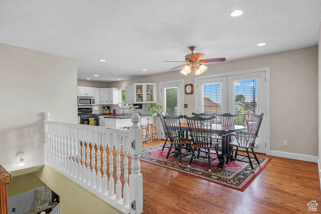 Dining room featuring a ceiling fan, light wood-style flooring, and recessed lighting