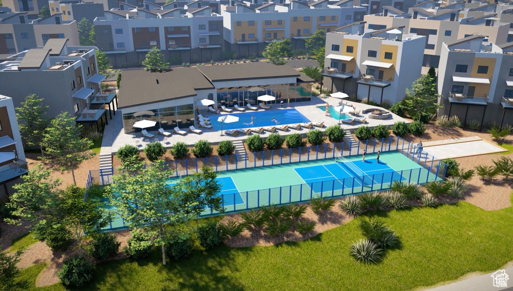 Aerial view of residential area featuring a pool area