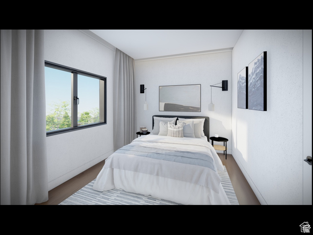 Bedroom featuring wood finished floors