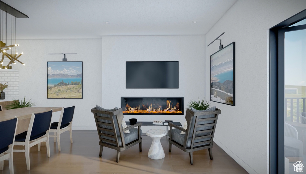 Living area featuring wood finished floors and a chandelier