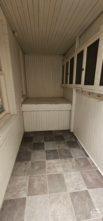 Sauna featuring stone finish flooring