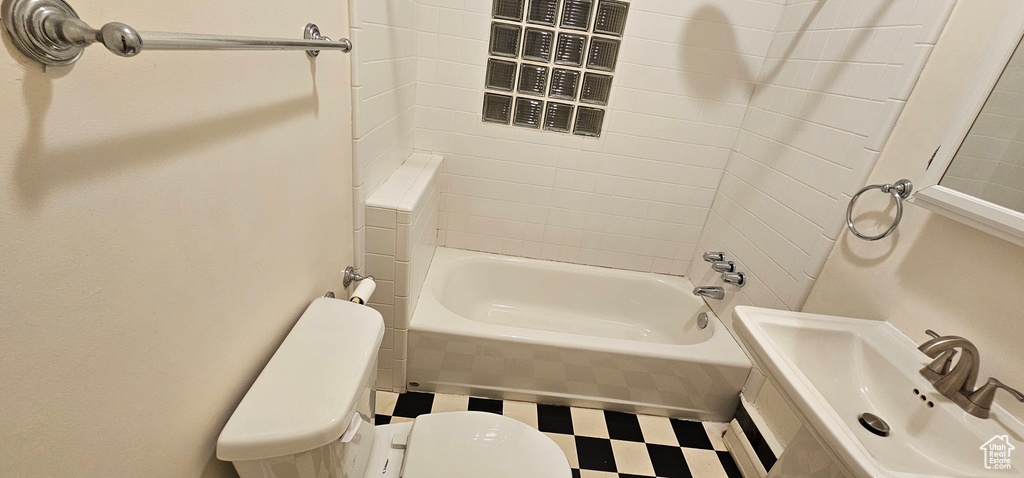 Bathroom with tile patterned floors, tub / shower combination, and pet washing station