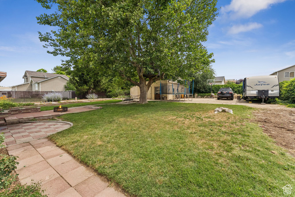 View of yard featuring a trampoline