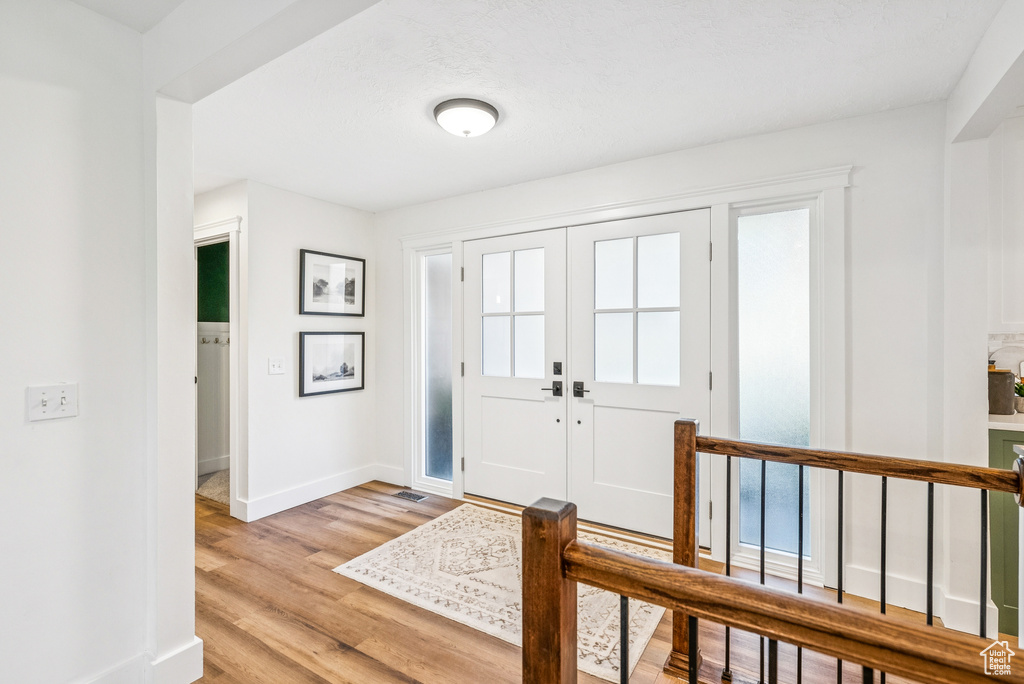 Entryway featuring light wood-style flooring and baseboards