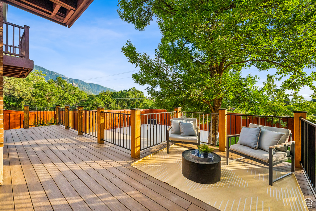 Deck featuring a mountain view and outdoor lounge area