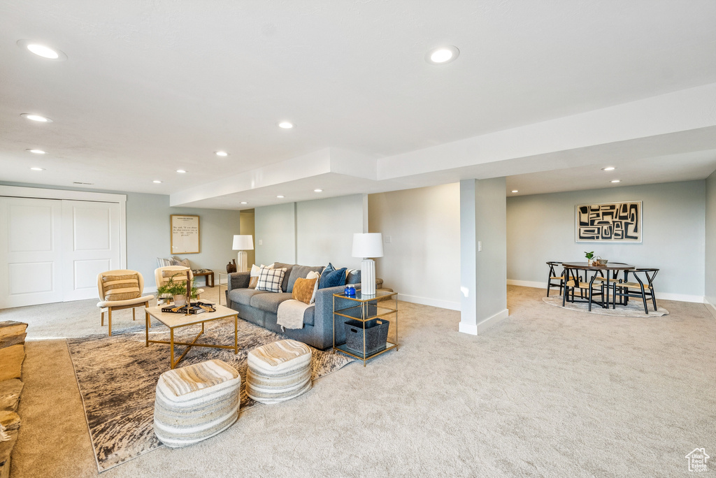 Carpeted living area featuring recessed lighting